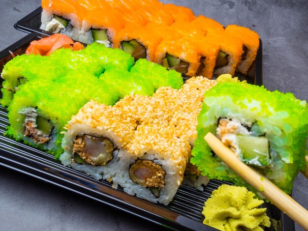 Eating sushi with chopsticks selective focus health Japan food