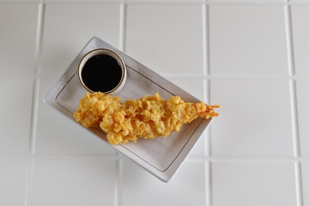 Ebi Tempura is Japanese cuisine made from Deep Fried Shrimps with tempura sauce.