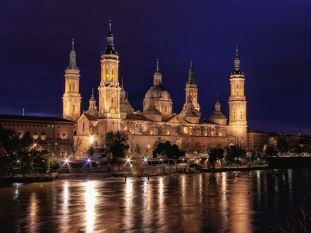 the Ebro river runs mighty through Zaragoza with the Basilica of Pilar as a centenary witness