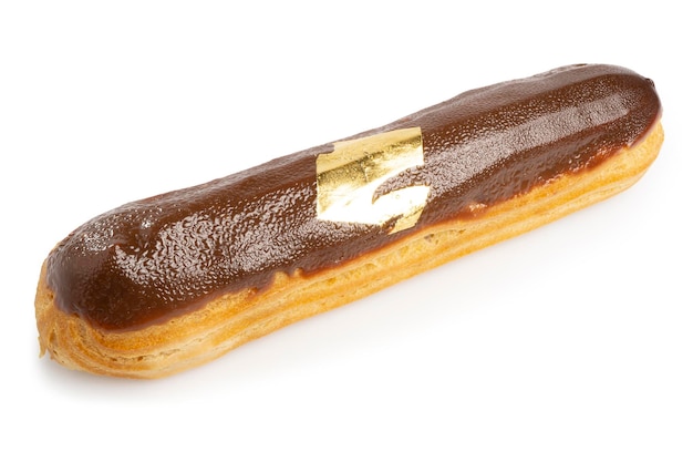 Фото Эклер или заварной крем в длинной форме с шоколадной пастой, украшенной сусальным золотом