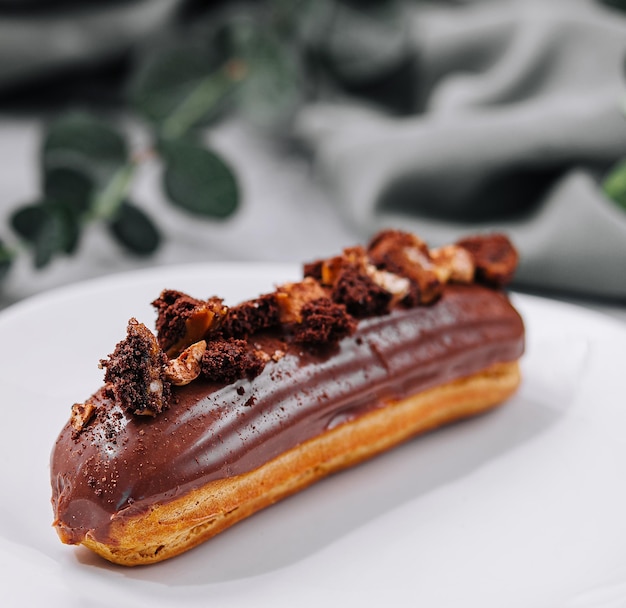 Eclair with Chocolate Cream and Hazelnuts