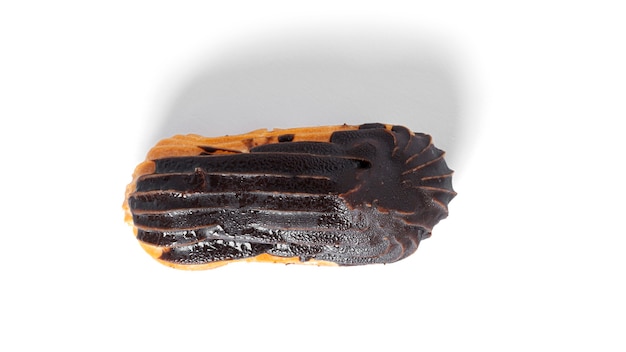 Eclairs in chocolate glaze isolated on a white background. High quality photo