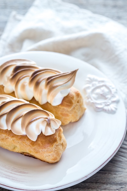 Eclairs with lemon curd and meringue