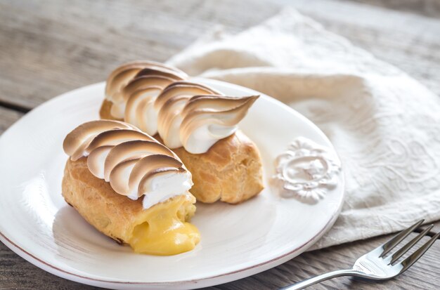 Eclairs with lemon curd and meringue