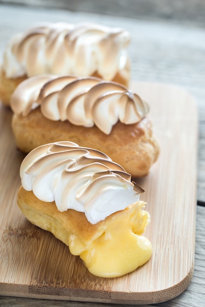 Eclairs with lemon curd and meringue