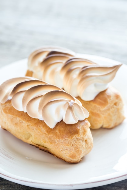 Eclairs with lemon curd and meringue