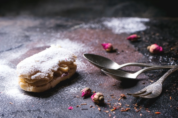 Eclairs with sugar powder