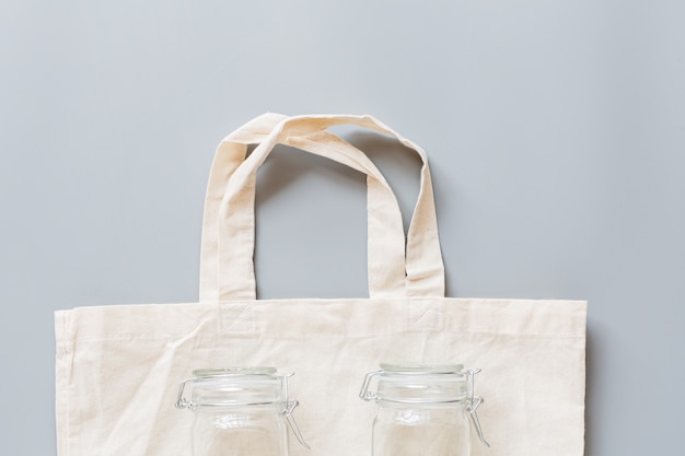 Photo eco bag and glasses pot flat lay