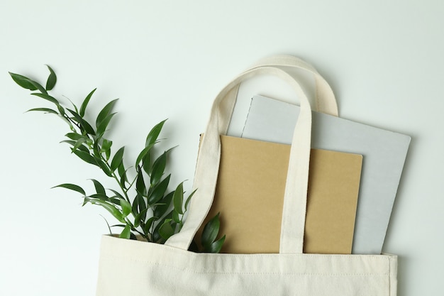 Eco bag with copybooks and twig