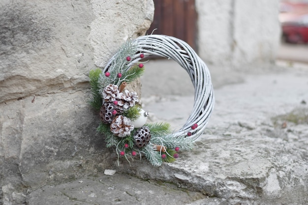 Eco christmas wreath, on gray stone background.