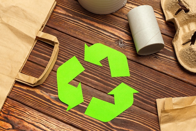 Eco concept with recycling symbol on table