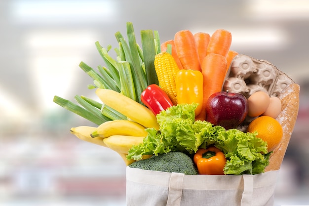 Eco day use shopping bag with vegetables grocery shopping in supermarket