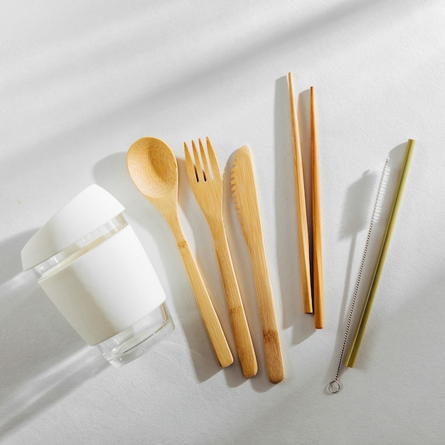 Eco friendly bamboo cutlery set and reusable coffee mug. Zero waste, plastic free concept.