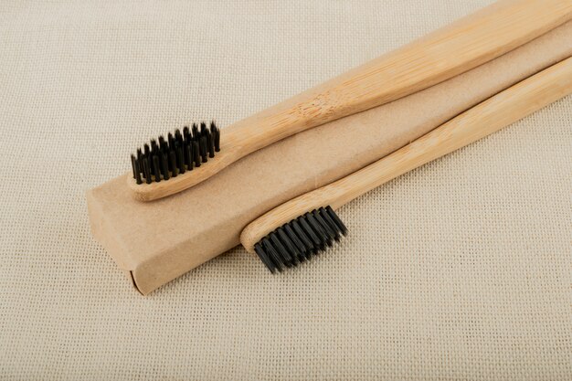 Eco-friendly bamboo toothbrush. Pastel background. Zero waste, life without plastic.