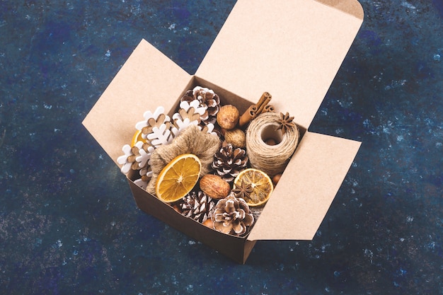 Photo eco friendly christmas with homemade natural decorations in a box.