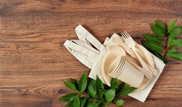 Eco friendly disposable dishes made of bamboo wood and paper Sustainable lifestyle concept