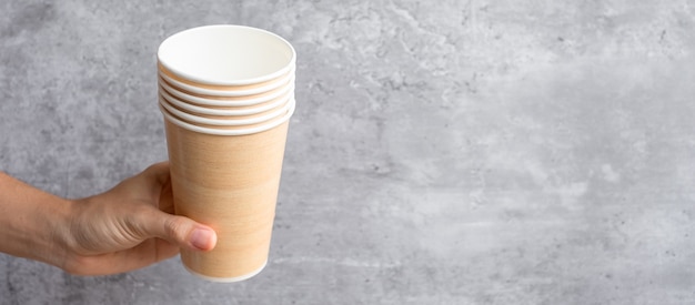 Eco friendly food packaging or takeaway coffee cup. Hand holding natural container for to go. zero waste, pollution, earth day, free plastic, world Environment day concept