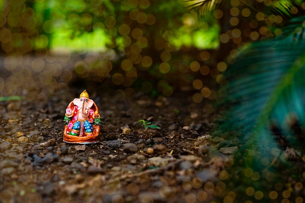 Eco friendly Ganesha idol or statue home made selective focus