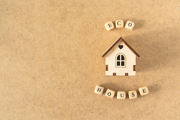 Eco friendly house - small toy model house with inscription word ECO HOUSE