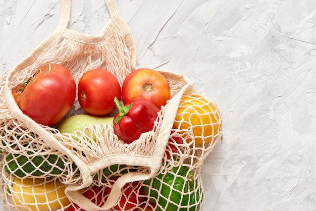 eco friendly mesh bag with fruit and veggies. 