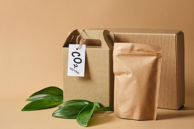 Photo eco friendly packaging marked co2 neutral, paper recycling, zero waste, natural products concept.