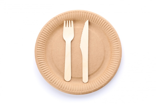 Eco - friendly plate with fork and spoon isolated on white. Disposable tableware