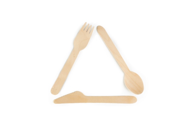 eco friendly recycling symbol from wooden utensil elements on a white. the earth protection from pollution.