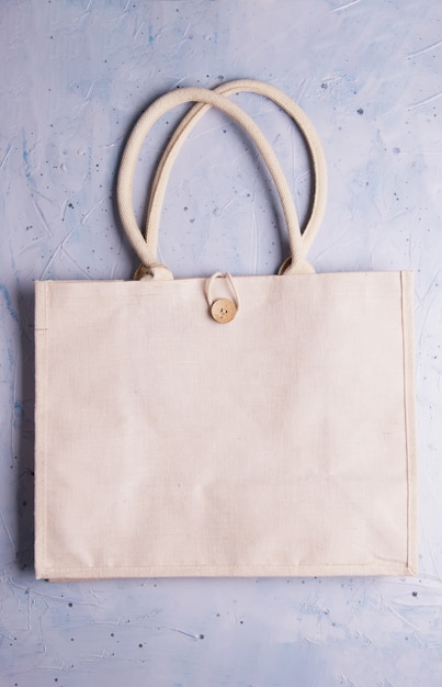 Eco friendly reusable recyclable cotton eco bag on gray .  zero waste