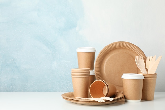 Eco - friendly tableware on white, space for text