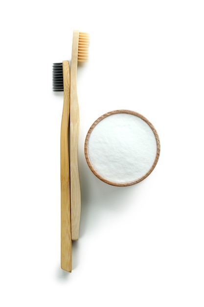 Eco friendly toothbrushes and tooth powder isolated on white