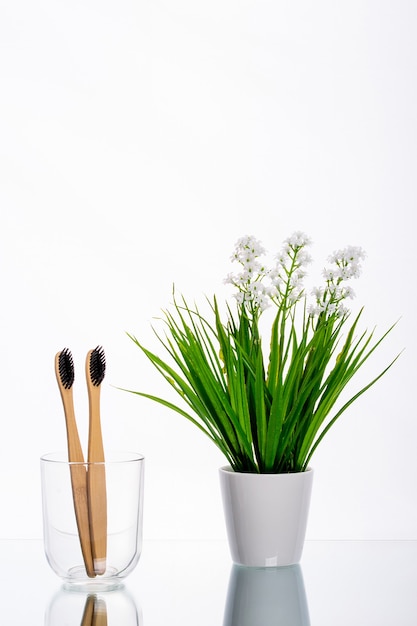 Eco toothbrushes made of wood in a glass glass