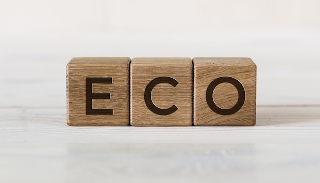 Eco word on a wooden cubes at the light table and light background