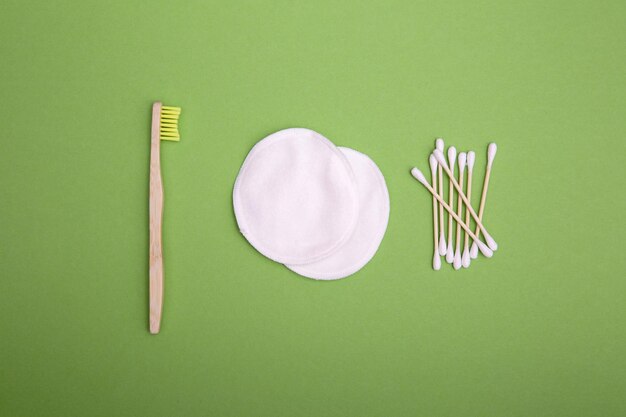 Ecofriendly bamboo toothbrush reusable cotton pads and wooden cotton swabs The concept of caring for the environment no plastic and zero waste Eco products for hygiene and personal care