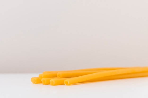 Ecofriendly pasta straws on light background with copy space