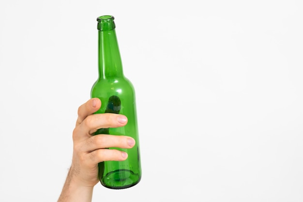 Ecology concept. Garbage sorting and recycling. Zero waste lifestyle. Glass bottle in man hand