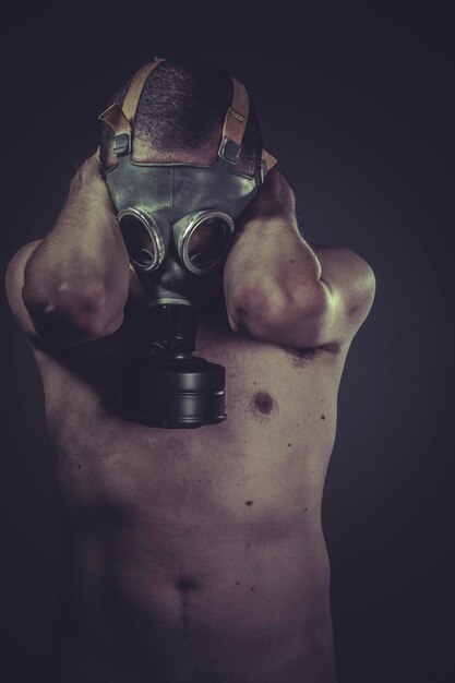 Ecology, Nude man with gas mask, pollution concept