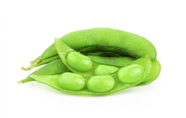 Edamame beans on white wall. 