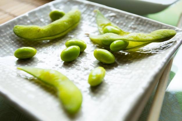 Photo edamame is a preparation of immature soybeans in the pod, found in cuisines with origins in east as