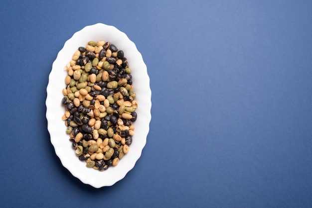 Edamame and toasted soy flat lay on plain color desk