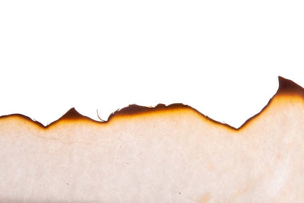 The edge of the burnt paper is insulated on a white background. High quality photo