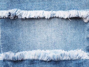 Premium Photo | Edge frame of blue denim ripped over jeans texture ...