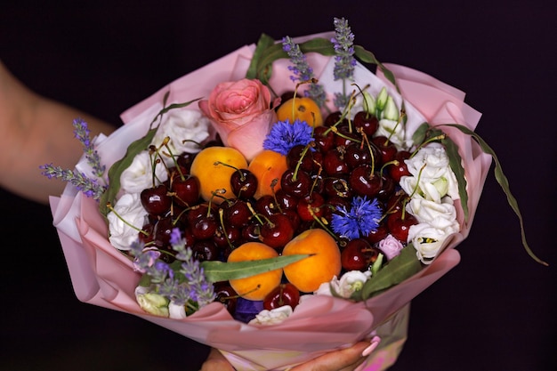 Edible bouquet of food floristry from fruits and roses magic gift