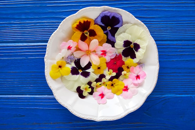 Edible flowers salad in a plate