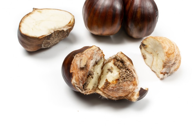 Edible sweet chestnuts, healthy delicious autumn and christmas veggie food close up.