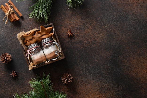 Edible two Christmas gifts of cookies and glass jar for making chocolate drink