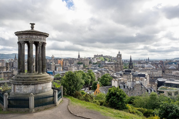 EDINBURGH SCOTLAND JUN12 2017 People travel to see view of Edinburgh city on Dugald Stewart Monument at dusk