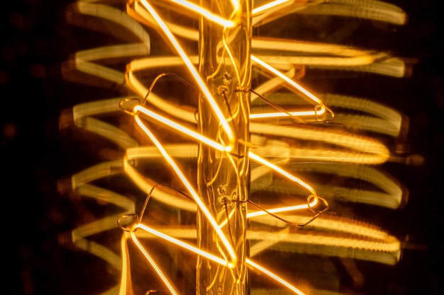 Edison light bulb filament macro abstract light background