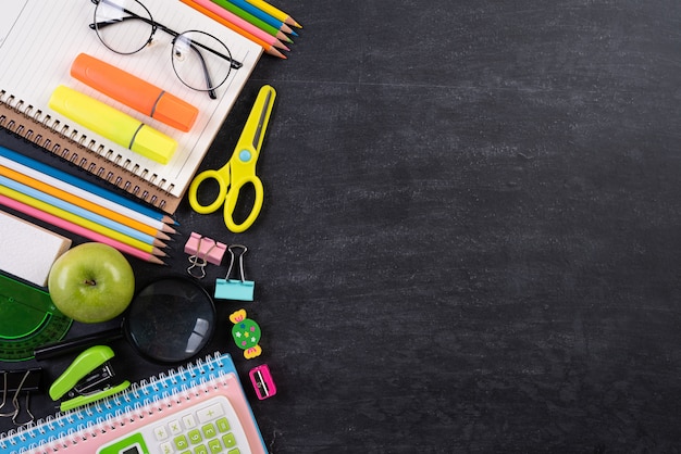 Education or back to school Concept on chalkboard background. Flat lay.