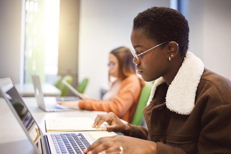 Photo education black woman and laptop for studying knowledge and learning in classroom african american female student and academic with online research study notes or prepare for exam test or focus