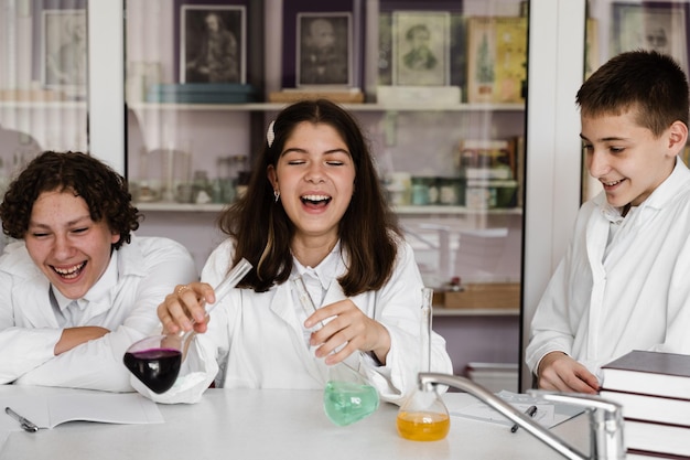 Education Chemical experiments at a chemistry lesson at school Children classmates making experiments in the laboratory